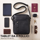 Kleine schwarze Leder-Schultertasche Dain, frontale Ansicht flach liegend, daneben Tablet 8 Zoll, Smartphone, Geldbörse, Reisepass und Zubehör
