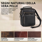 Piccola borsa a tracolla in pelle nera con manico e tracolla, vista frontale con tasca con zip e logo STILORD impresso