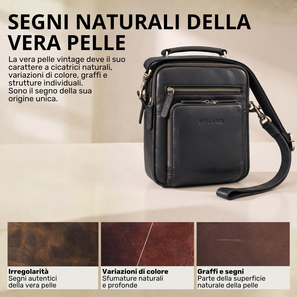 Piccola borsa a tracolla in pelle nera con manico e tracolla, vista frontale con tasca con zip e logo STILORD impresso